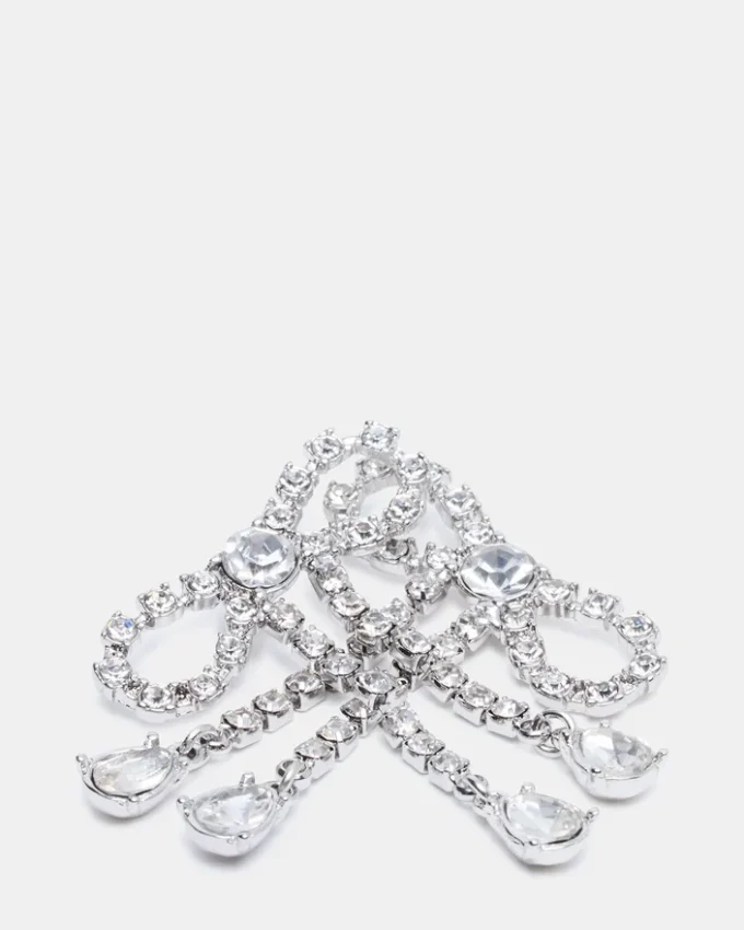 Boucles d’oreilles en forme de nœud avec strass argentées Boucles d’oreilles en forme de nœud avec strass argentées