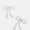 Boucles d’oreilles en forme de nœud avec strass argentées Boucles d’oreilles en forme de nœud avec strass argentées
