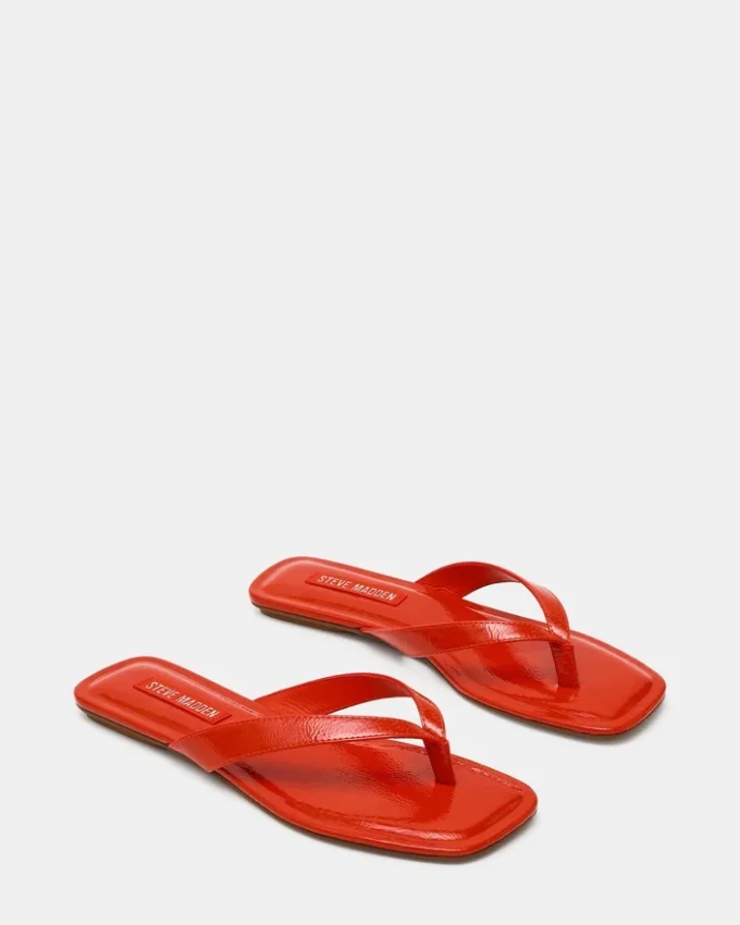 Trella en vernis rouge-orange Trella en vernis rouge-orange