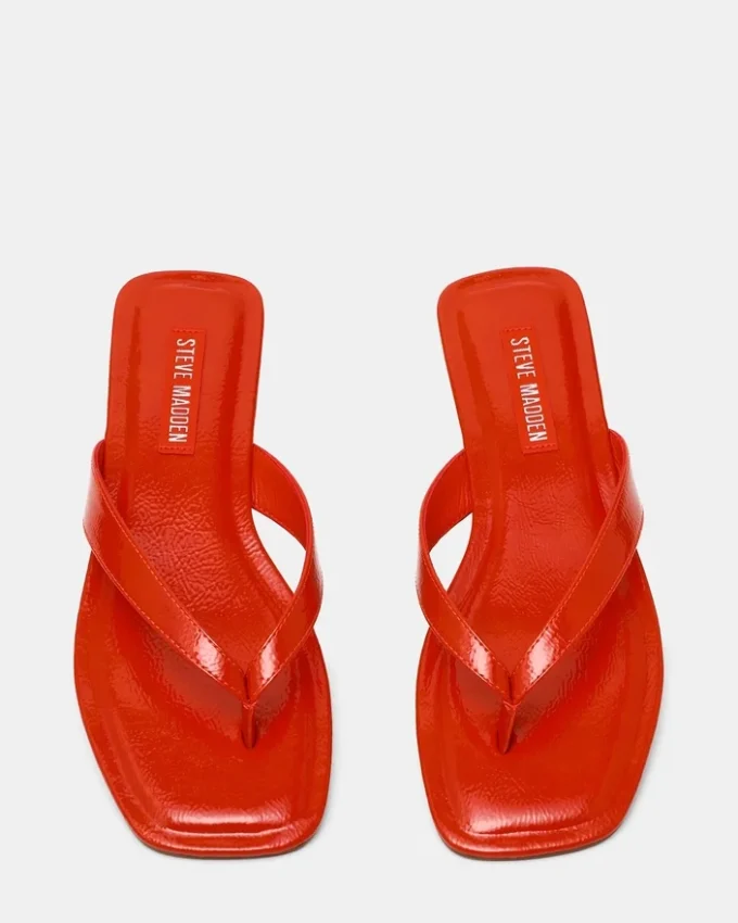 Trella en vernis rouge-orange Trella en vernis rouge-orange