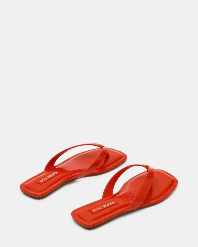 Trella en vernis rouge-orange Trella en vernis rouge-orange